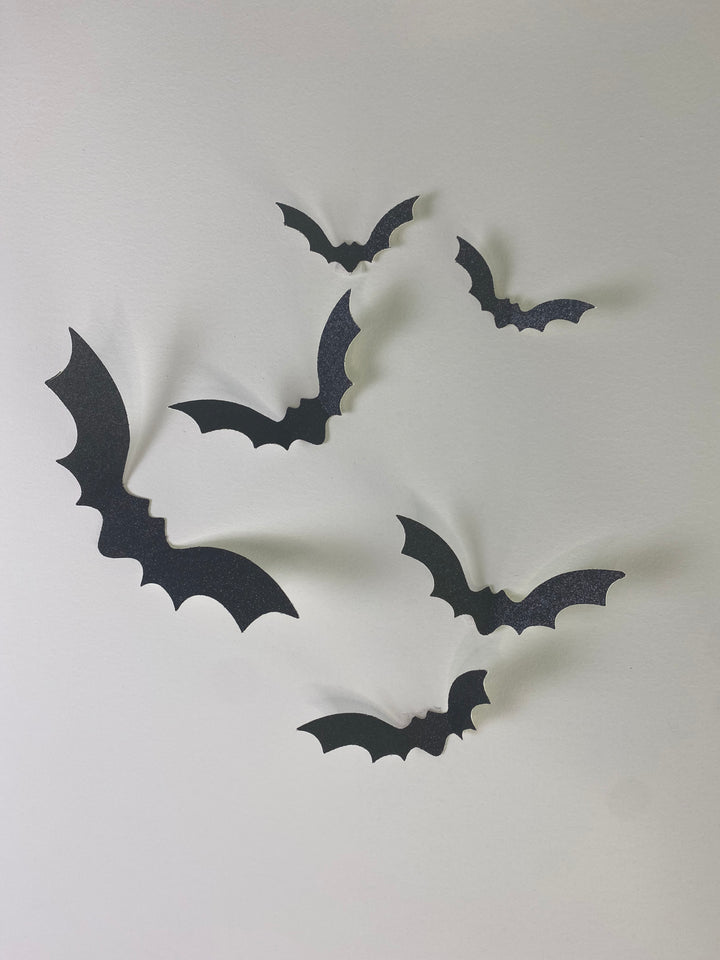 3D bat wall decals with raised wings casting shadows in hallway
